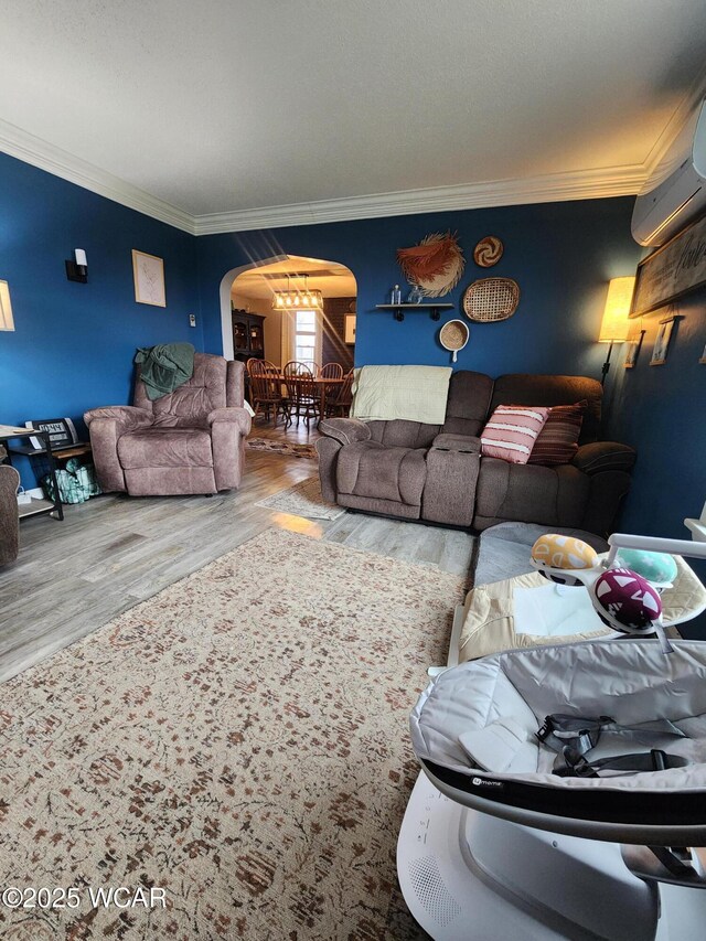 carpeted bedroom featuring a baseboard radiator and a chandelier