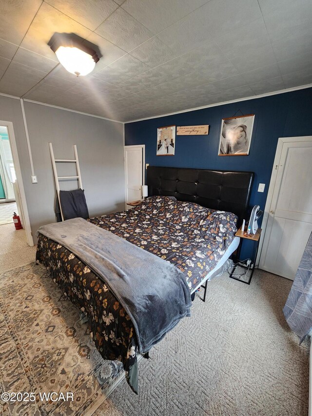 bedroom with carpet floors and ornamental molding