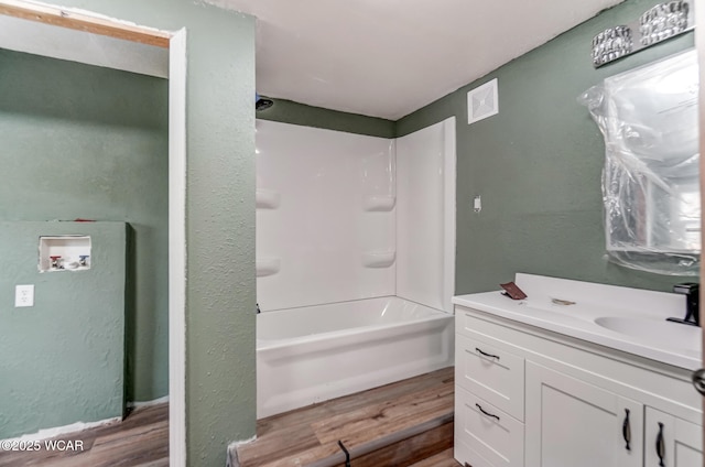 520 Orena Ave, Lima, OH 45804 - bathroom featuring vanity, hardwood / wood-style flooring, and shower / washtub combination