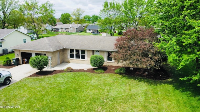 4836 Willow St, Lima, OH 45807 - ranch-style home featuring a garage, roof with shingles, a front lawn, and driveway