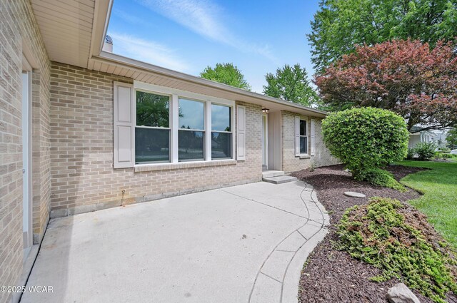 4836 Willow St, Lima, OH 45807 - view of front of house featuring a patio area and brick siding