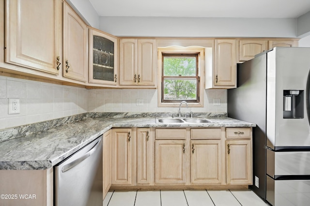 4836 Willow St, Lima, OH 45807 - kitchen with light brown cabinetry, a sink, appliances with stainless steel finishes, and glass insert cabinets