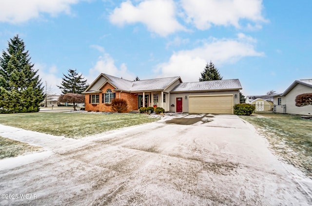 ranch-style home with a garage and a front lawn