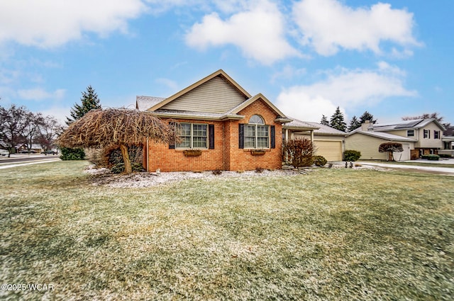 view of front of property with a garage and a front lawn