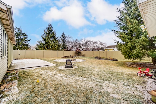 view of yard featuring an outdoor fire pit and a patio