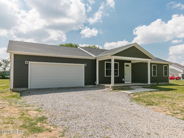 3232 Schooler Rd, Lima, OH 45806 - ranch-style home with a porch, an attached garage, and gravel driveway