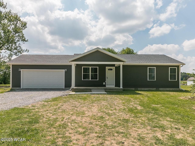 3232 Schooler Rd, Lima, OH 45806 - ranch-style home with covered porch, an attached garage, a front yard, driveway, and a shingled roof