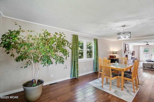 2715 Goldenrod Ln, Findlay, OH 45840 - dining space featuring hardwood / wood-style floors, baseboards, a chandelier, ceiling fan, and crown molding