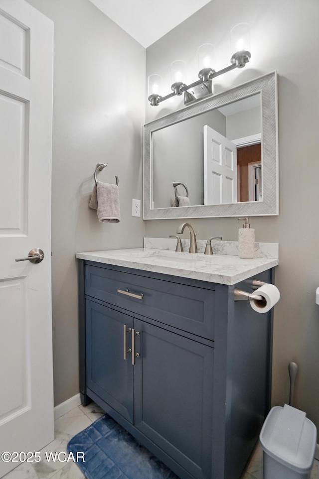 2715 Goldenrod Ln, Findlay, OH 45840 - bathroom featuring vanity, toilet, marble look tile flooring, and baseboards