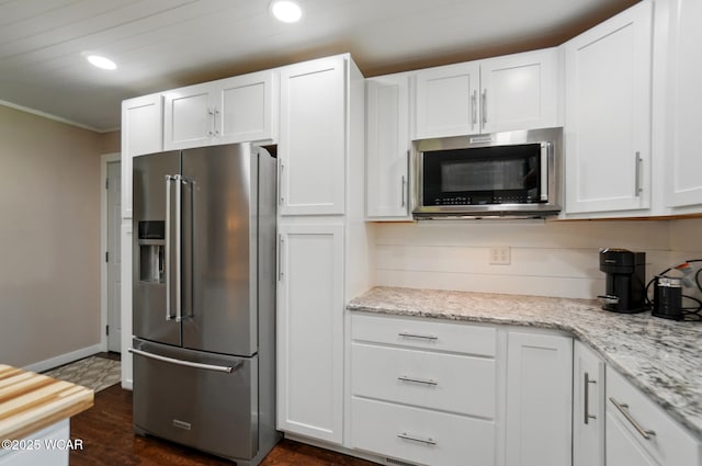 2715 Goldenrod Ln, Findlay, OH 45840 - kitchen featuring stainless steel appliances, recessed lighting, white cabinetry, ornamental molding, and light stone countertops