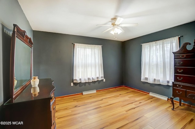 bedroom with light hardwood / wood-style flooring and ceiling fan