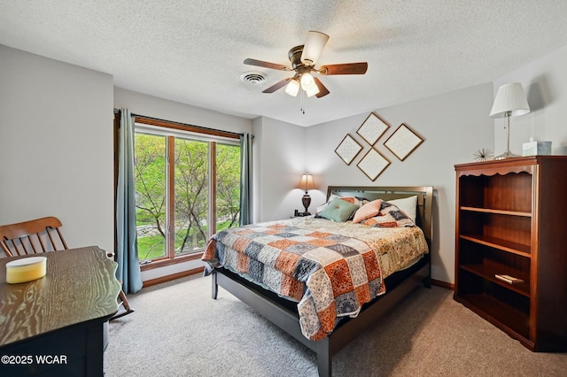 2979 Sands Rd, Lima, OH 45805 - bedroom with carpet floors, a ceiling fan, and a textured ceiling
