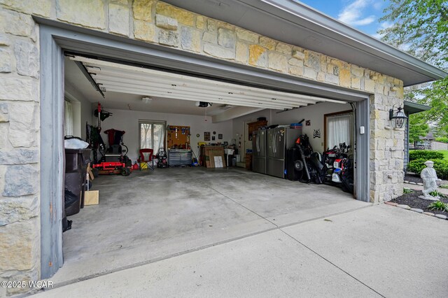 2979 Sands Rd, Lima, OH 45805 - garage with a garage door opener and driveway