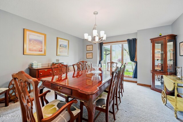 2979 Sands Rd, Lima, OH 45805 - dining area with light colored carpet and a chandelier