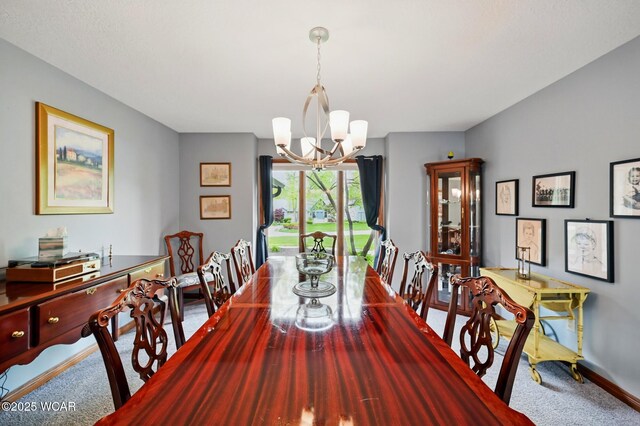 2979 Sands Rd, Lima, OH 45805 - carpeted dining room with a chandelier and baseboards