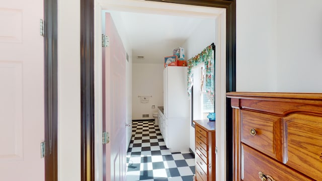 corridor with tile patterned floors and visible vents