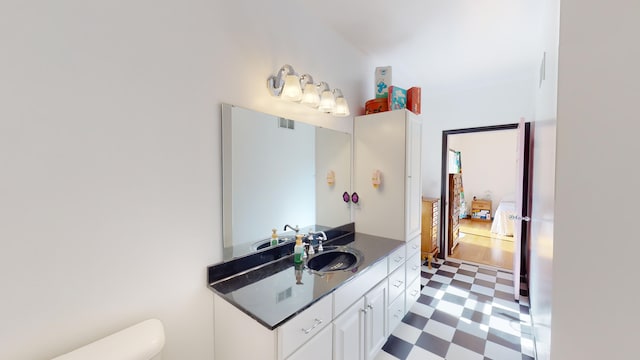 bathroom with tile patterned floors, toilet, and vanity