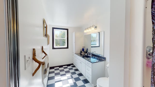 bathroom with tile patterned floors, toilet, and vanity