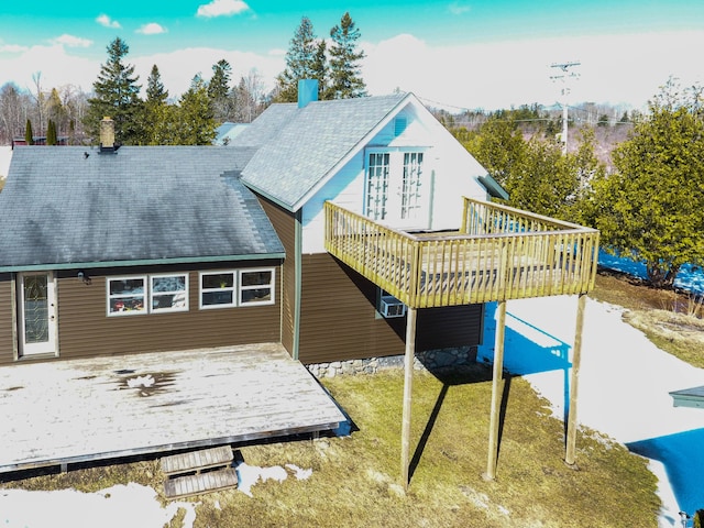 back of property featuring a deck