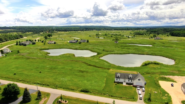 aerial view with a water view and a rural view