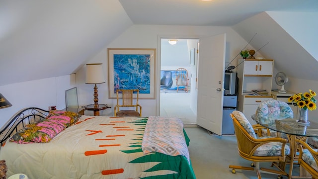 carpeted bedroom featuring vaulted ceiling