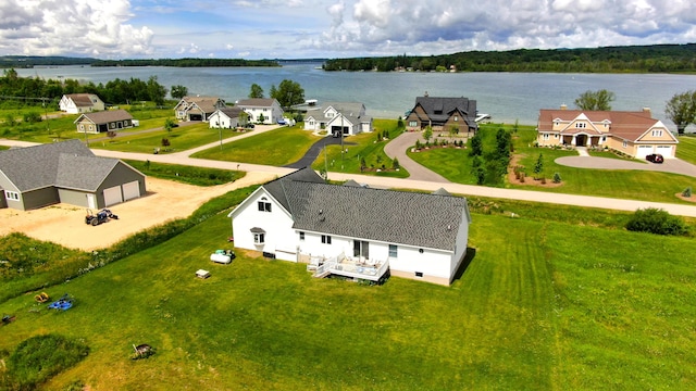 birds eye view of property featuring a residential view and a water view