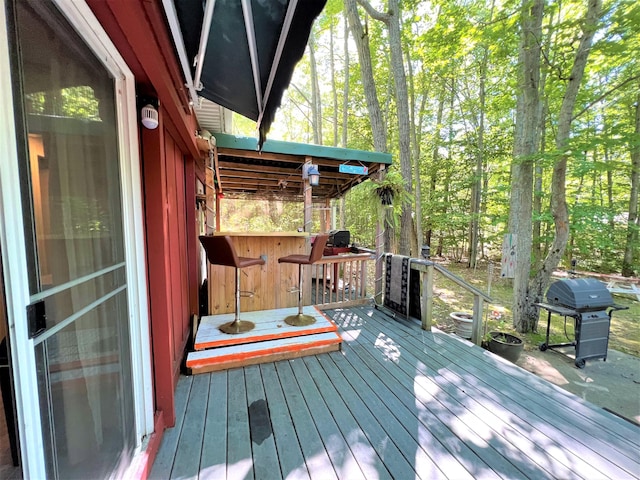 wooden deck featuring area for grilling