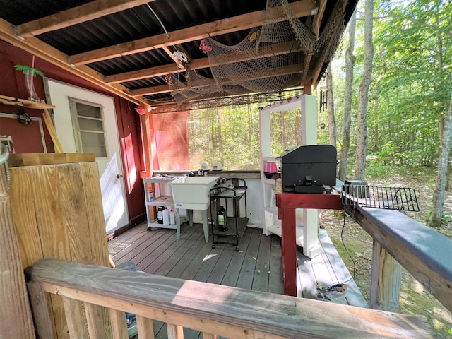 wooden deck featuring a sink