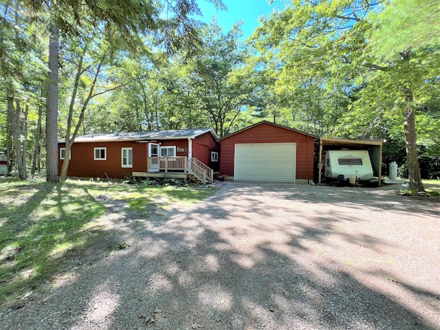 view of front of property featuring an outbuilding and a detached garage