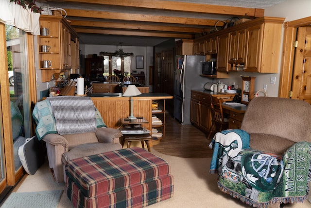 living room featuring beam ceiling