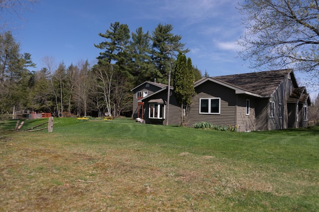 view of home's exterior with a yard