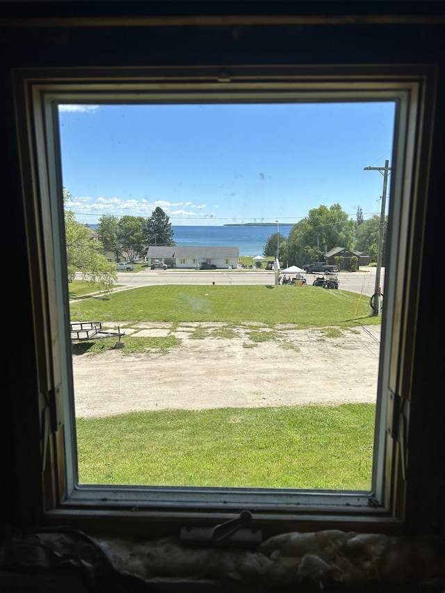 doorway to outside featuring a water view