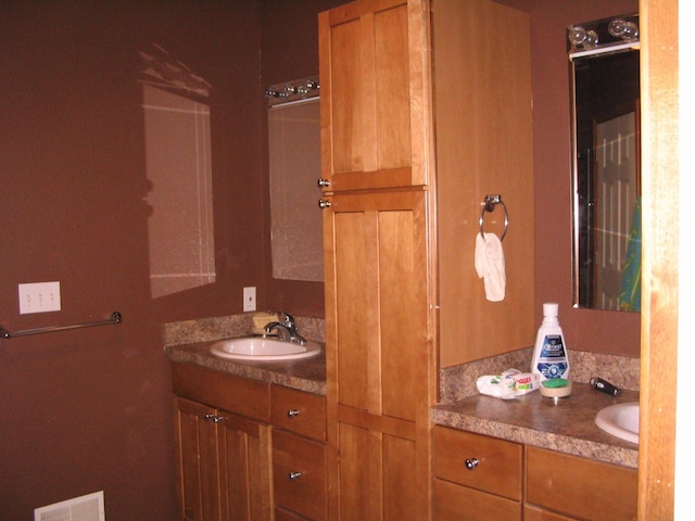 bathroom with visible vents and vanity