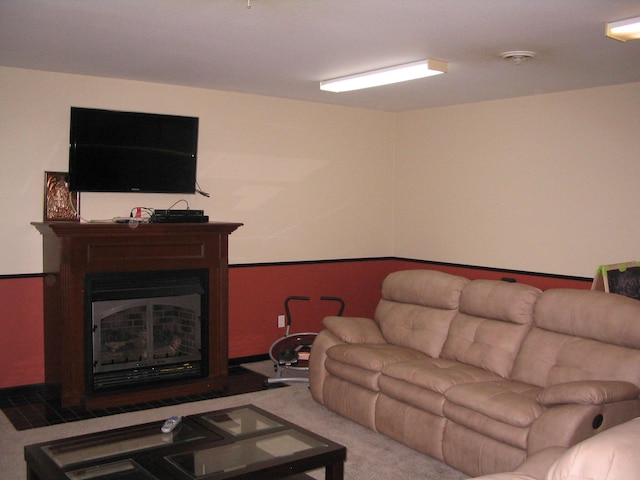 living area with carpet flooring and a fireplace