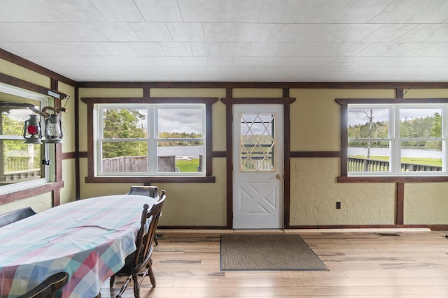 9219 Tall Birch, Gaylord, MI 49735 - dining room featuring healthy amount of natural light, wood finished floors, and baseboards