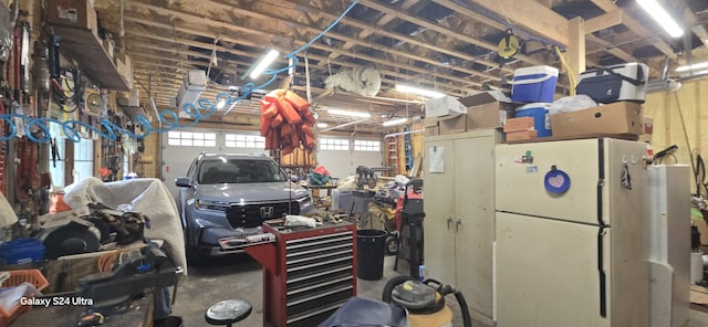 garage with freestanding refrigerator