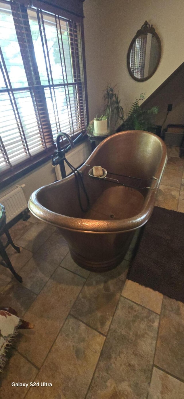 bathroom featuring a freestanding bath