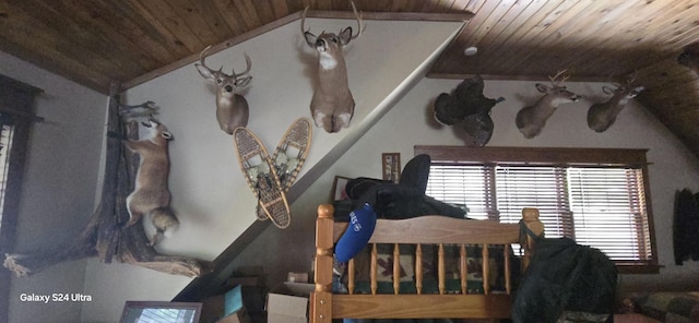 bedroom with wood ceiling and vaulted ceiling