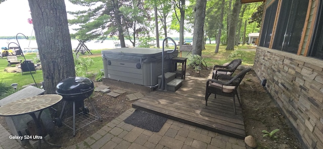 deck with a hot tub