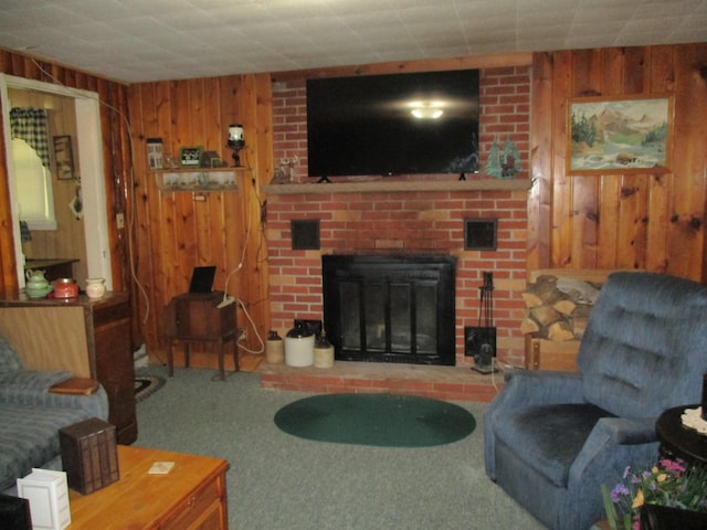 carpeted living area featuring wooden walls and a fireplace