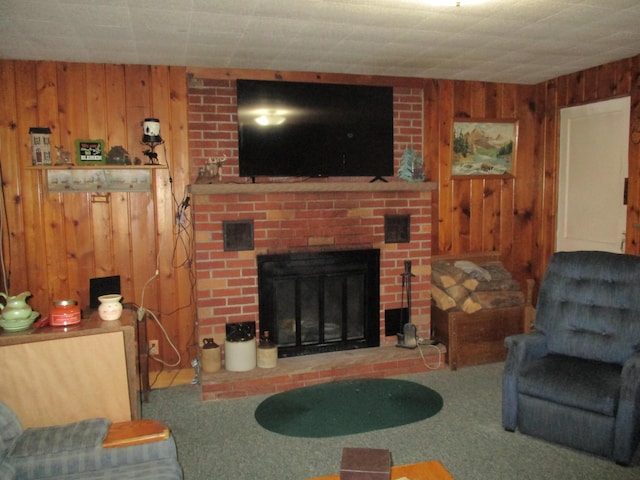 living room featuring wooden walls, a brick fireplace, and carpet