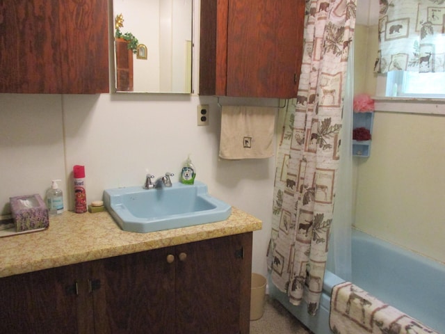 bathroom featuring vanity and shower / tub combo