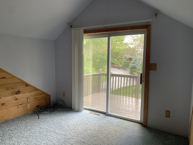 bonus room with lofted ceiling, carpet flooring, and visible vents