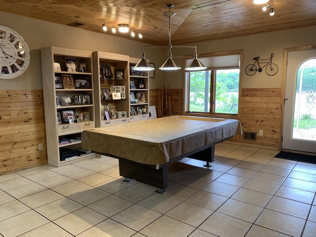 rec room featuring wooden ceiling, wooden walls, light tile patterned floors, and visible vents