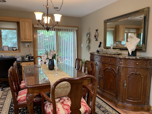 dining area with a notable chandelier