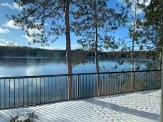 wooden deck featuring a water view