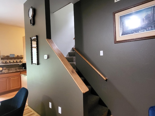 staircase with wood finished floors