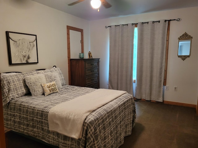 carpeted bedroom featuring baseboards and ceiling fan