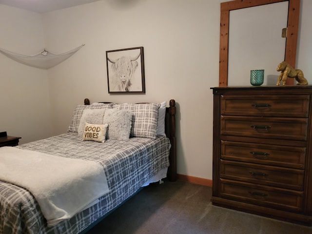 bedroom with carpet flooring and baseboards