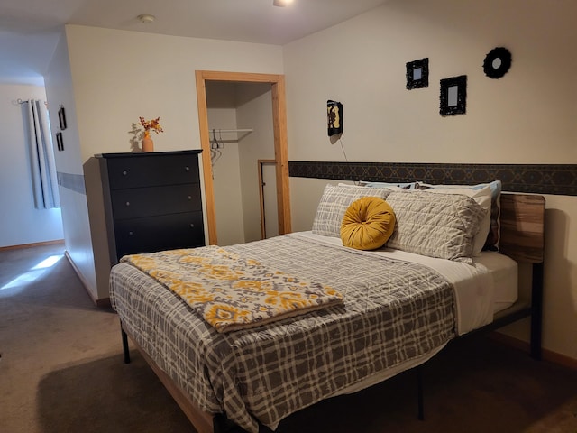 bedroom with baseboards and carpet floors